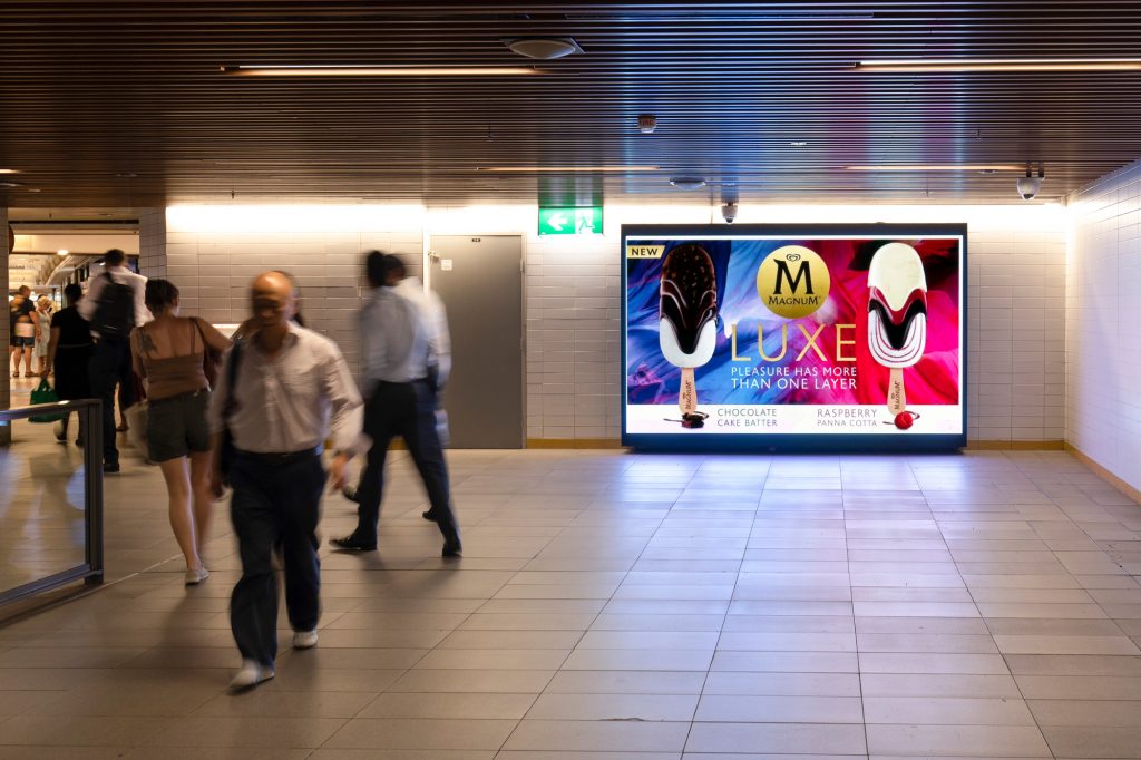 Magnum rail advertising in train station