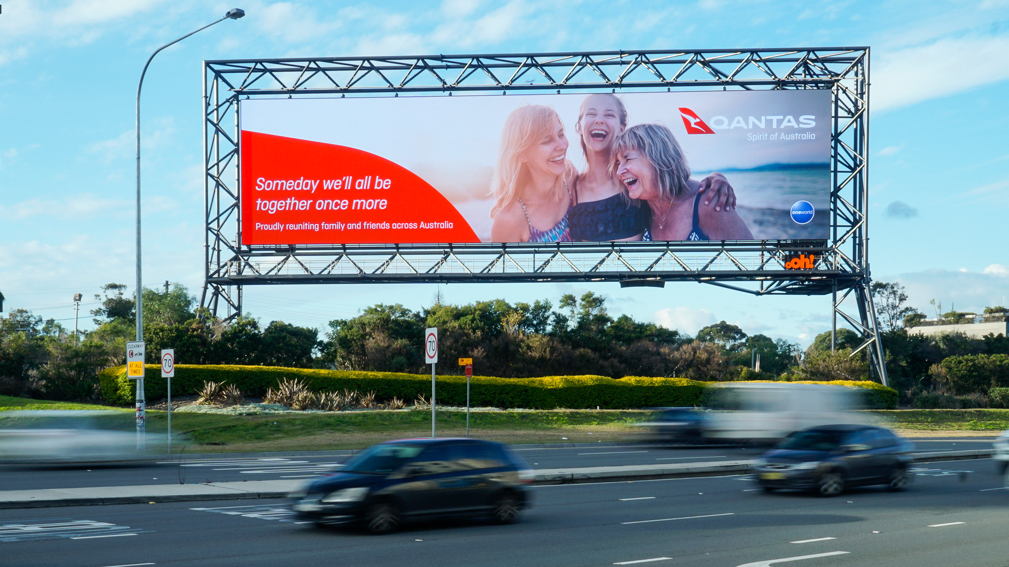 Qantas advertising on billboard in airport and on road