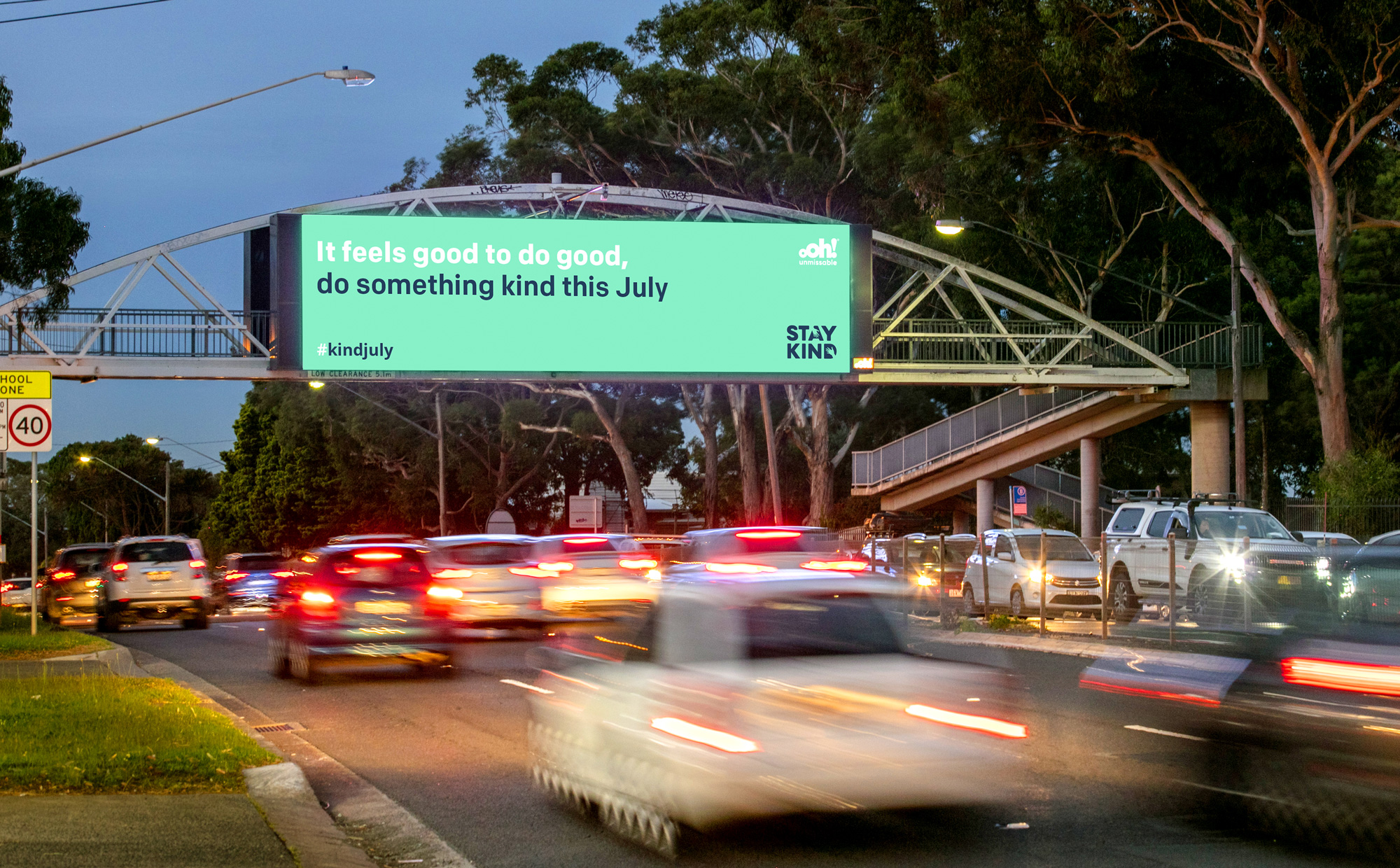 Stay Kind billboard advertising on road