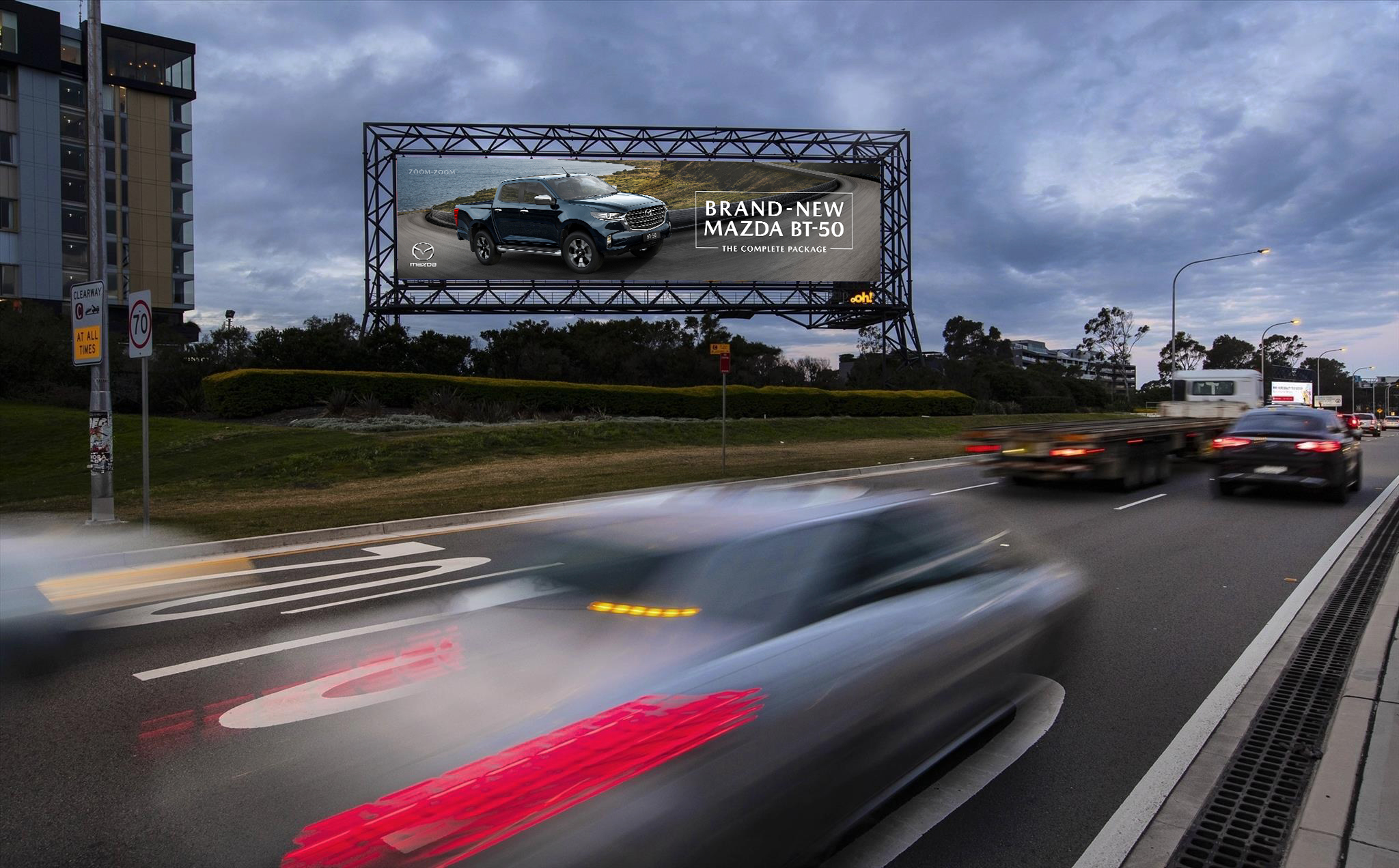 Mazda billboard advertising on road near airport