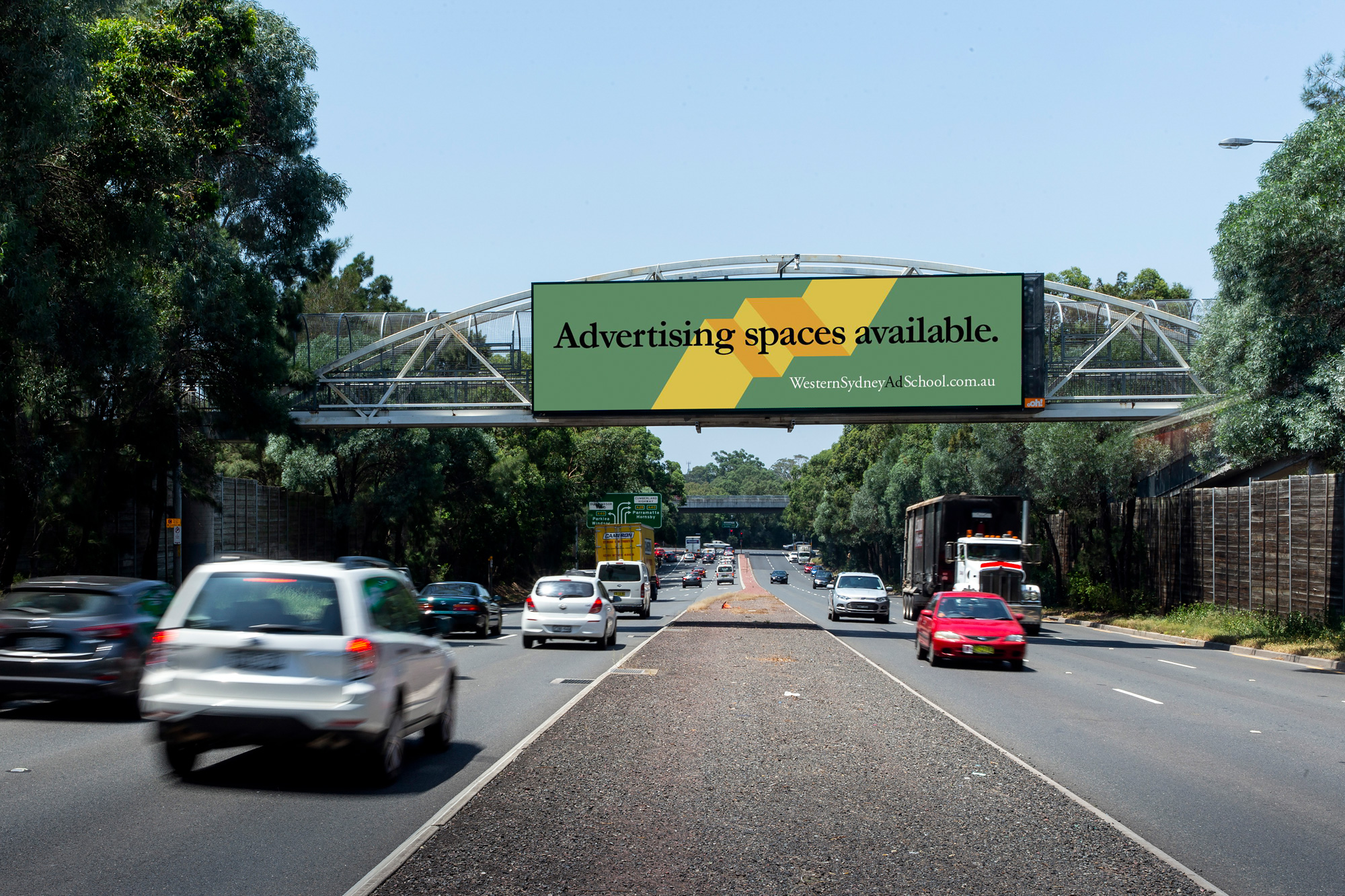 Western Sydney Ad School billboard advertising on road in Sydney
