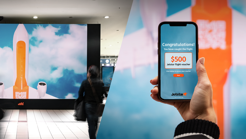 Jetstar advertising campaign in train station utilitising a QR code to allow scanning to win flights on mobile phones.