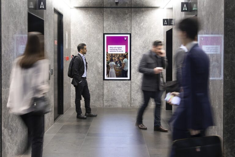 Digital advertising OOH panel in office lobby Sydney