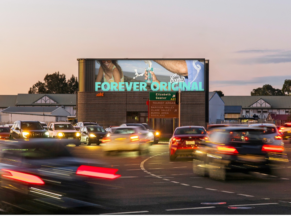 Digital large format billboard at busy junction with Cooper's creative