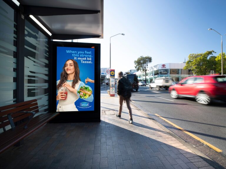 Digital street furniture bus stop advertising featuring Tassal creative