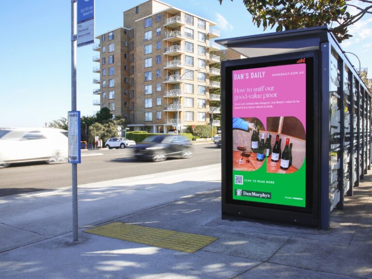 Digital street furniture bus stop advertising featuring Dan Murphy’s creative