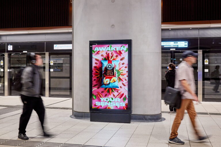 Digital train station advertising panel at Melbourne Metro's State Library