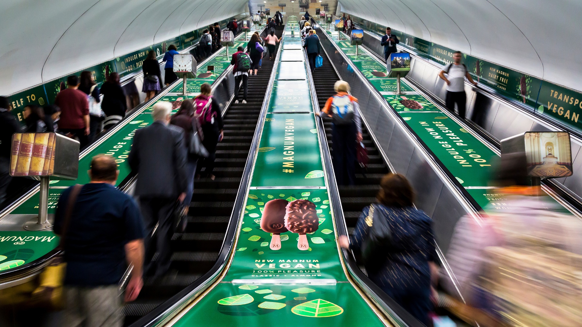 Escalator decals in rail station advertising domination