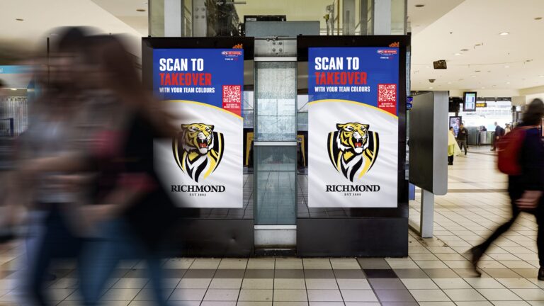 Melbourne train station digital advertising screen OOH featuring AFL dynamic creative