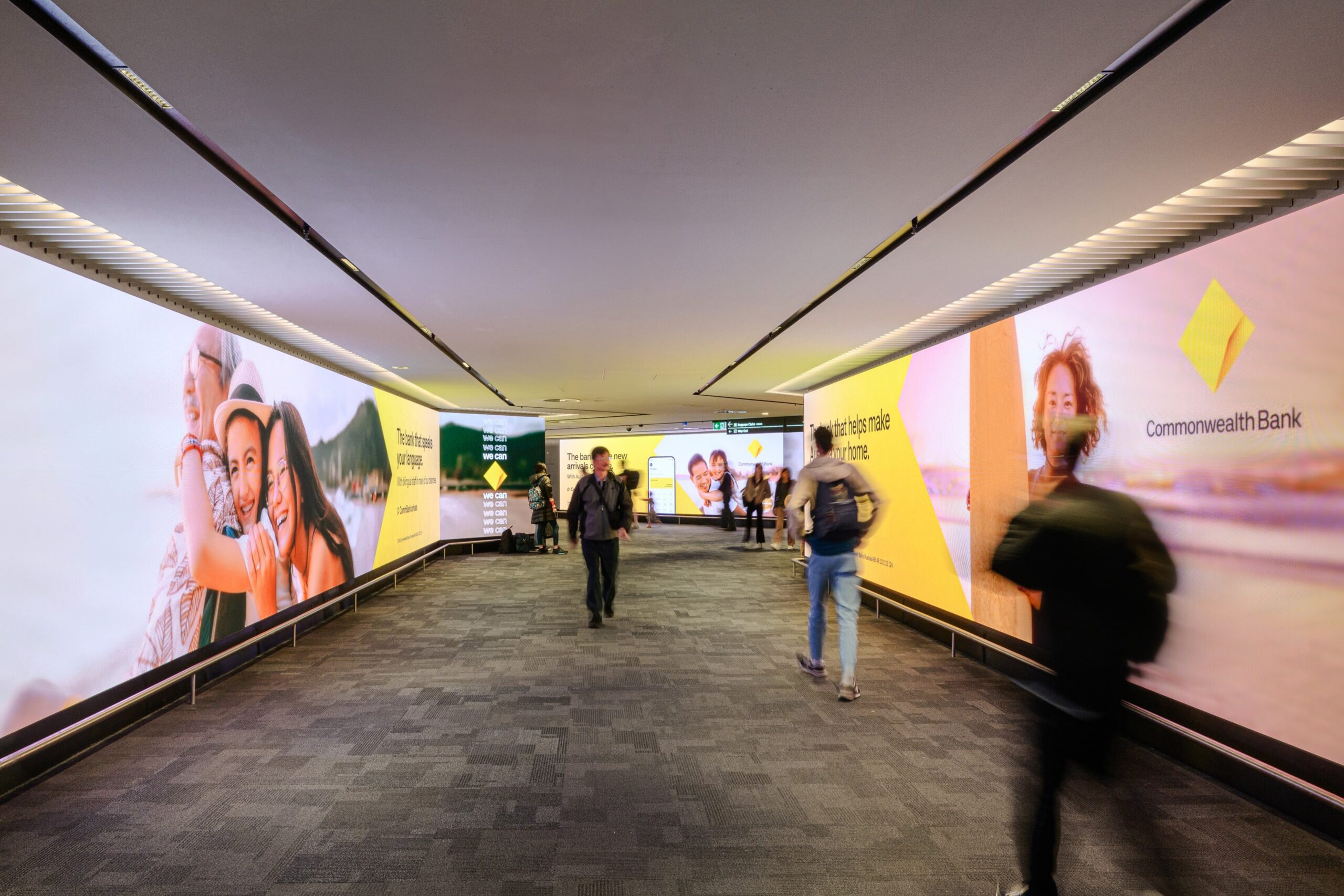 Immersive wall digital advertising screens at Melbourne airport arrivals