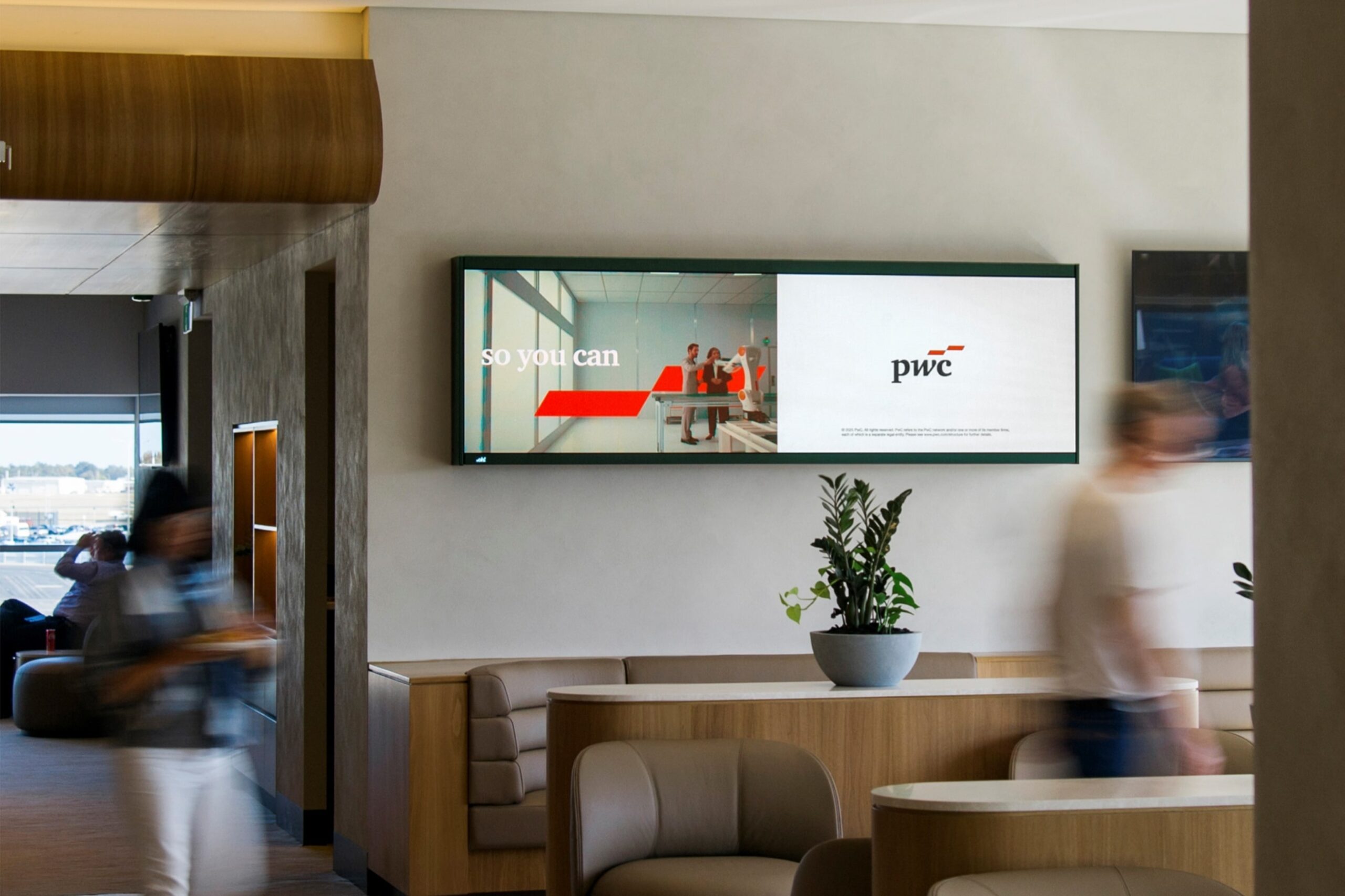 Digital advertising screen in Qantas airport lounge