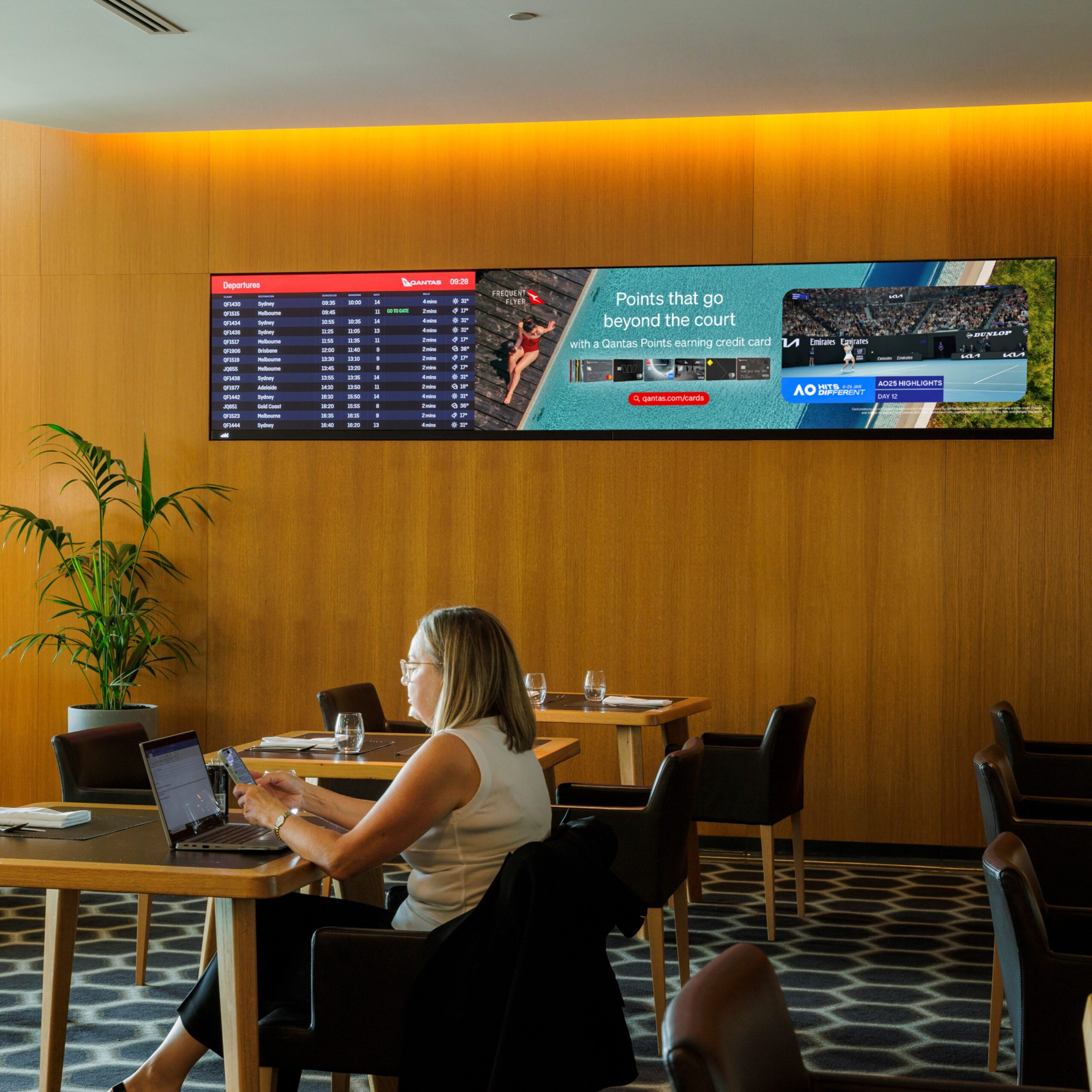 Digital advertising screen in airport Qantas Chairman's Lounge