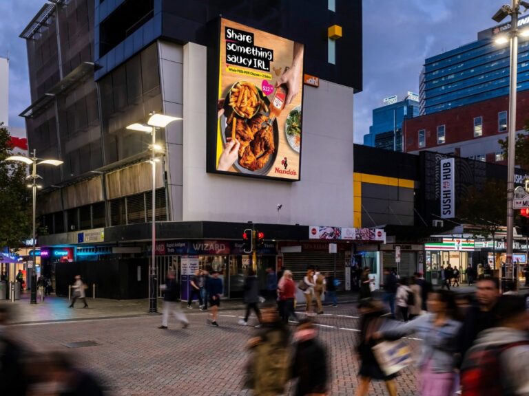 Large format digital billboard featuring Nando’s creative