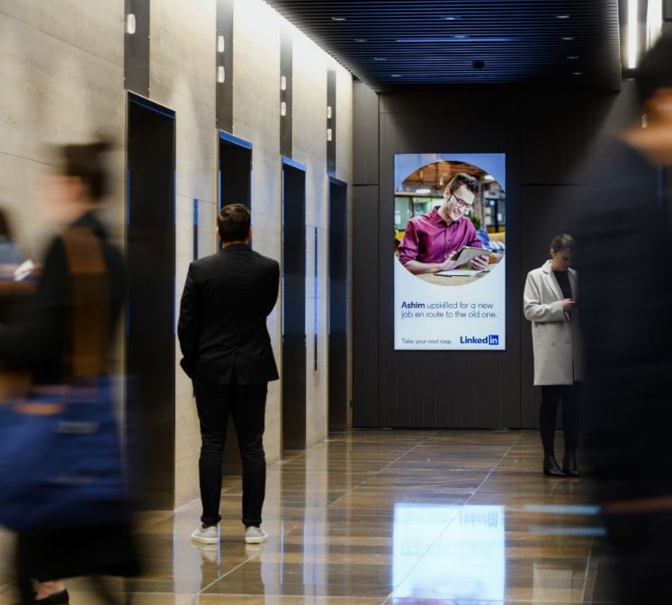 Digital portrait screen in office lobby