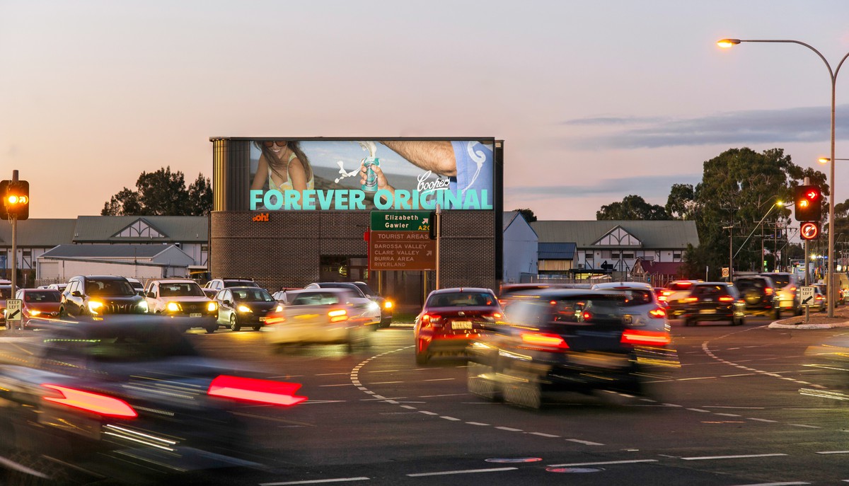 Digital large format billboard at busy junction with Cooper's creative