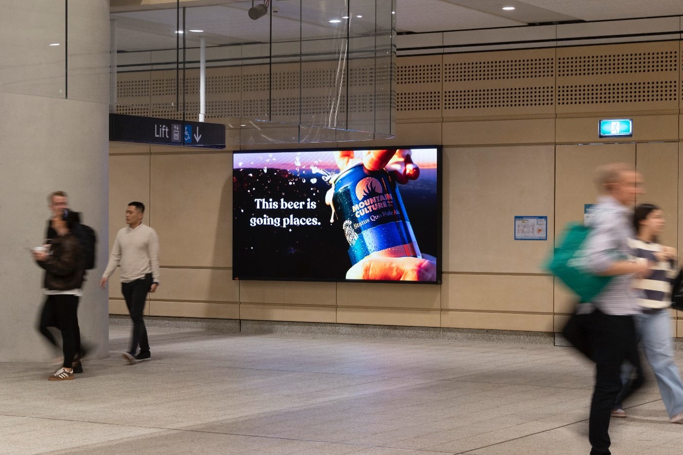 Digital advertising screen in Sydney Metro Martin Place rail station, Mountain Culture creative