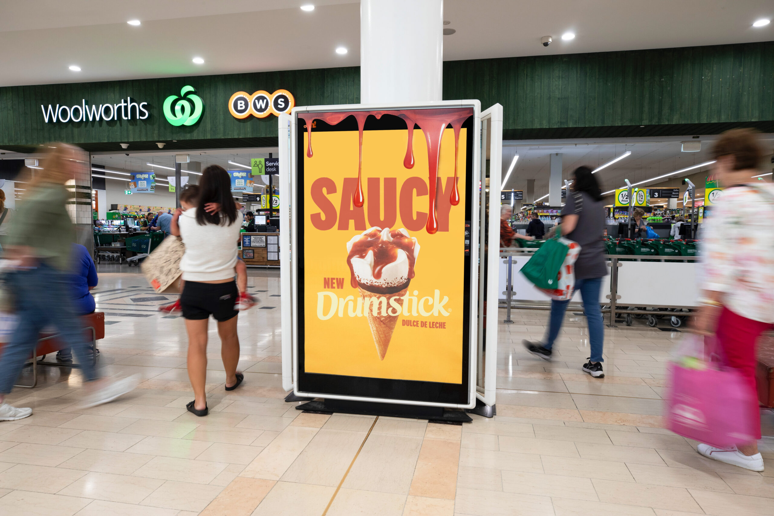 Digital retail advertising panel in Melbourne, Drumstick Saucy campaign