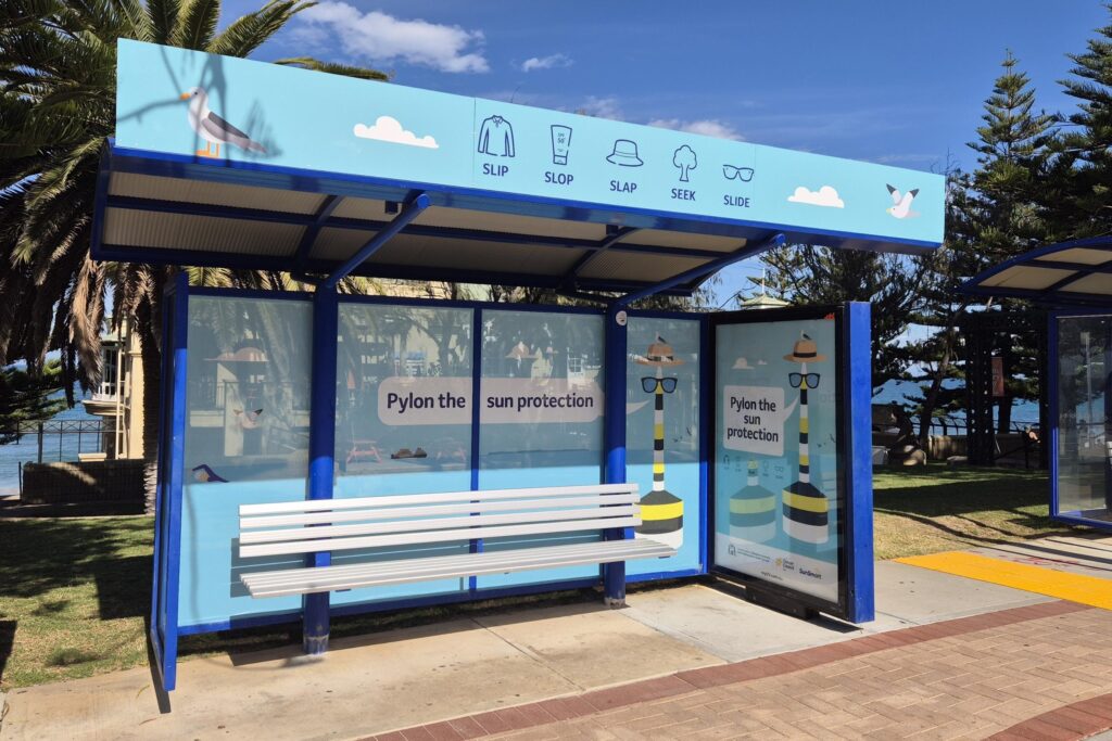 Bus shelter advertising for Cancer Council WA at Cottesloe Beach, Perth.