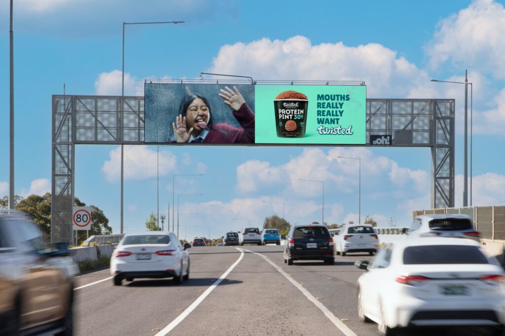 Digital billboard in Melbourne featuring Twisted Treats advertising