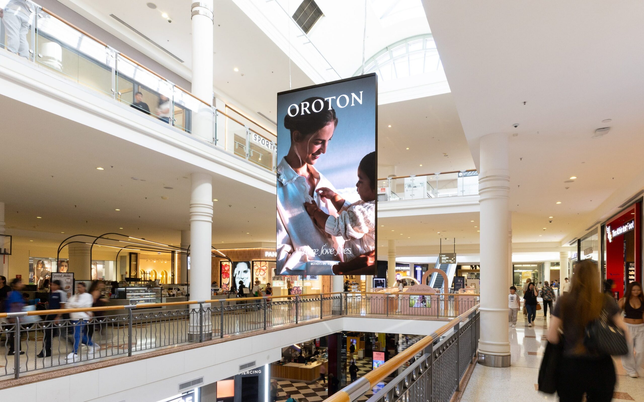 Digital advertising panel in retail centre Castle Towers, featuring Oroton Mother's Day creative