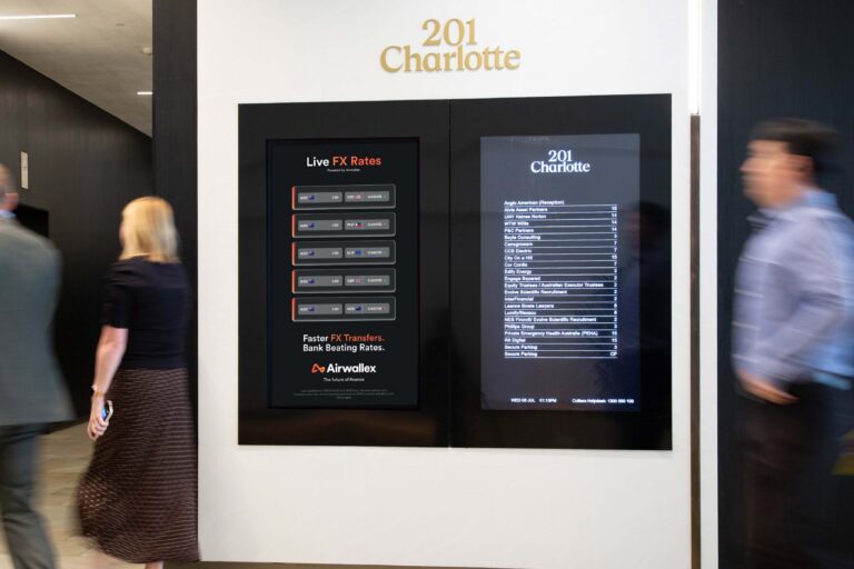 Digital office advertising screen in Australia, with Airwallex FX data