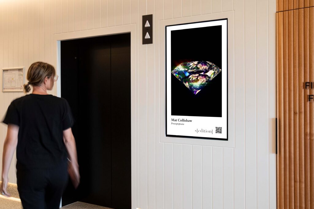 Digital advertising panel in office, featuring Sedition artwork