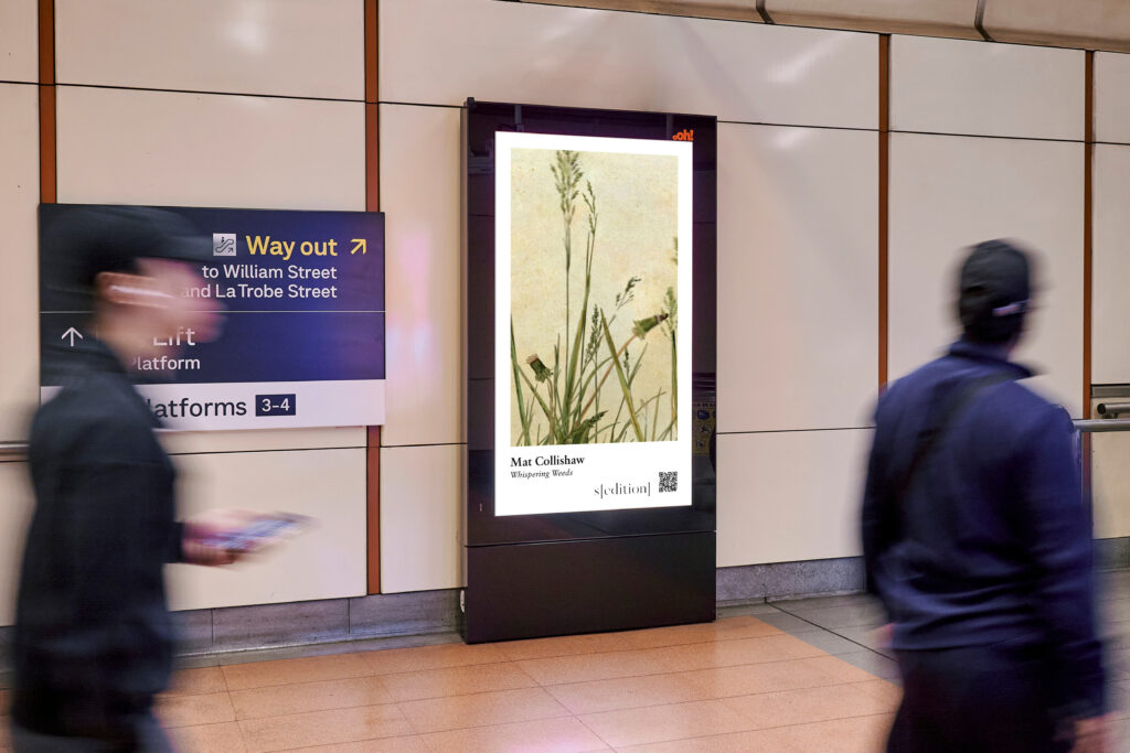 Digital advertising panel in rail station, featuring Sedition artwork