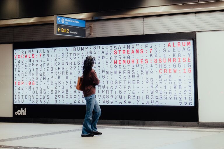 Digital advertising panel in Melbourne Metro Tunnels rail station, featuring Powderfinger campaign